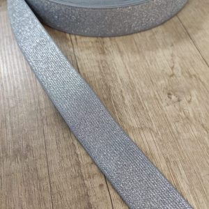 Лента эластичная , блестящая . Серая с серебром. Ширина 30 мм